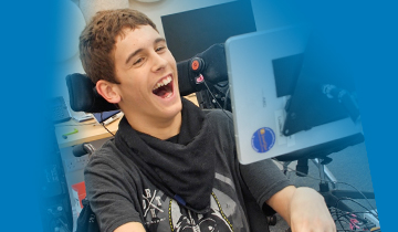 Smiling young man using technology